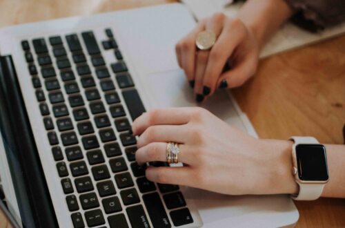 Woman`s hands on the laptop